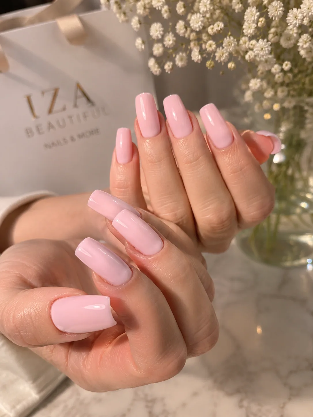 Glossy pink square manicure created at Iza Studio